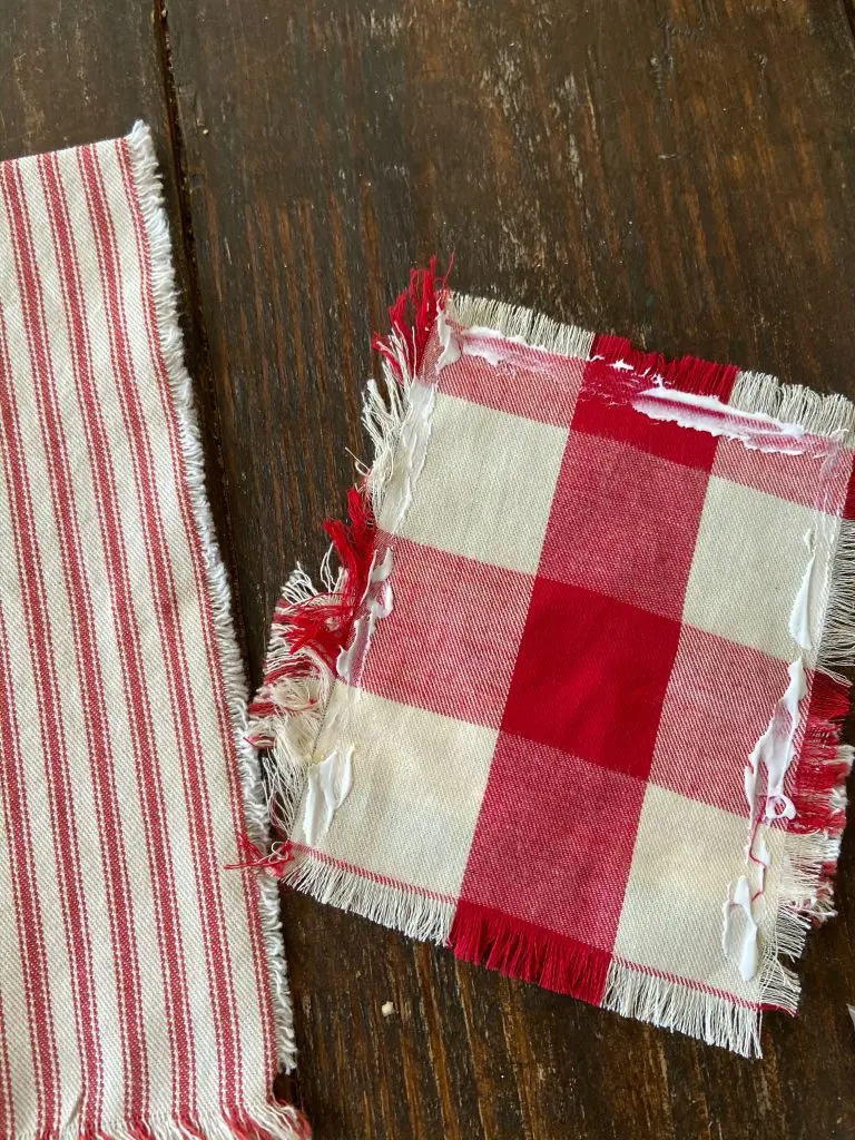Use fabric glue to attach pocket for no-sew Christmas DIY Cutlery Pocket Napkins.