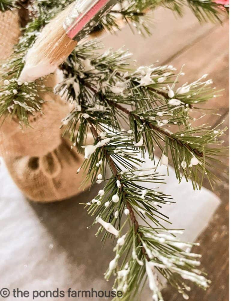 Cheap Christmas Decorations using faux snow technique to flock your Christmas tree.
