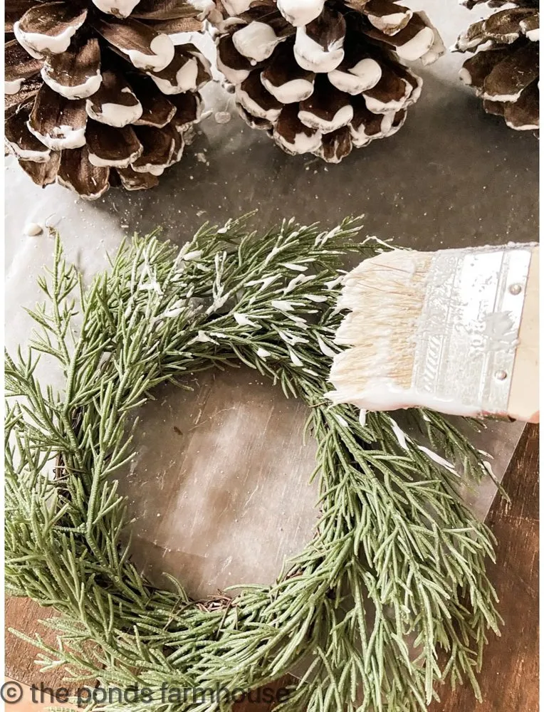 Add flocking to the wreaths and pinecones for Christmas Decorating ideas