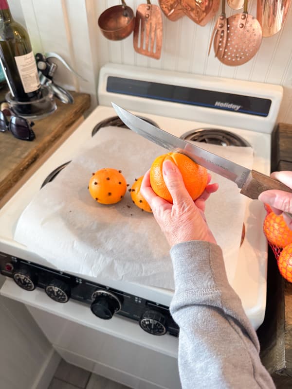 Slice whole orange peel to dry oranges whole.