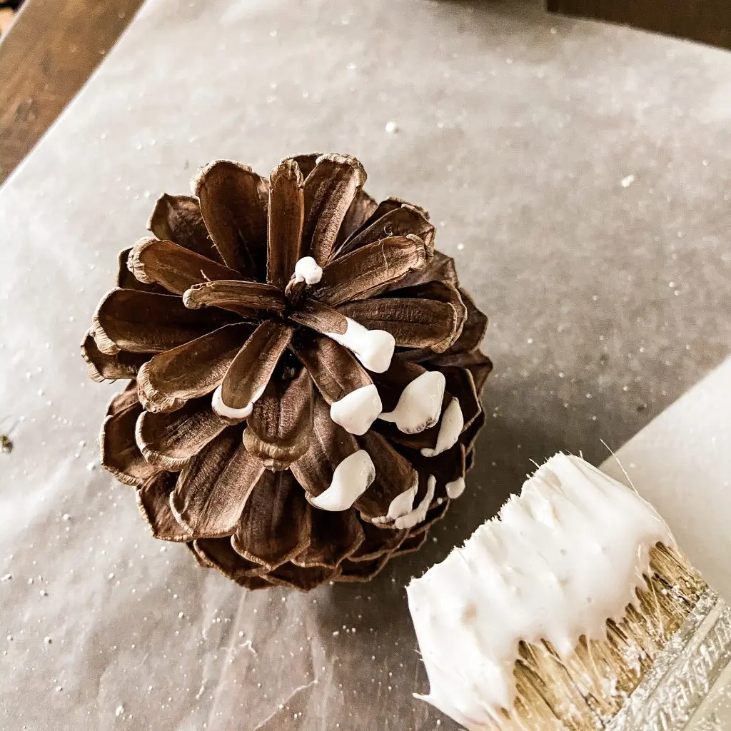 Us the 2 Step Flocking Tutorial to add snow to pinecones for Christmas Farmhouse Decorating.