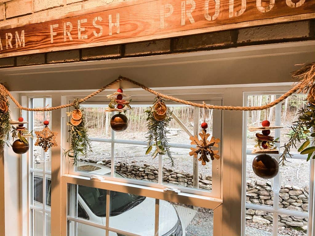 hang dried fruit and herb Christmas Garland over kitchen window in the farmhouse. Cottage Core Craft Idea for the holidays.