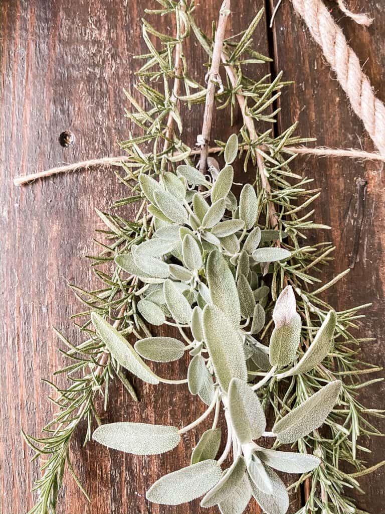 jute twine, fresh rosemary and fresh sage on a jute garland