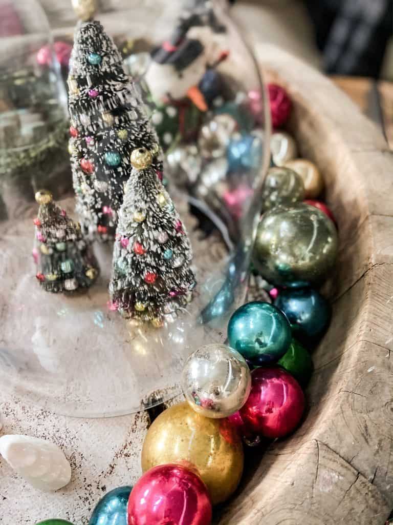 Shiny Brite ornaments fill a wooden bowl 