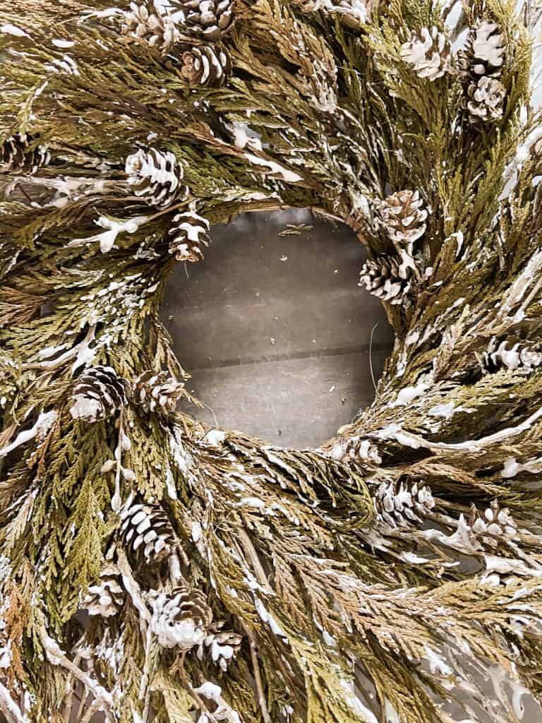 Add Flocking to an old wreath to update it for repurposed Christmas Decorating ideas.