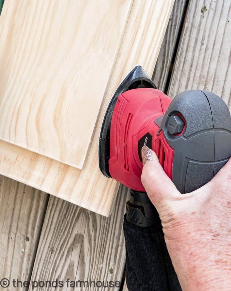 use mouse sander to smooth edges of the DIY table riser.