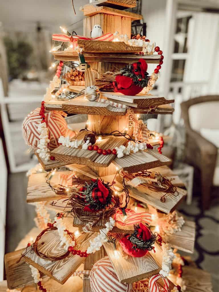 DIY Shiplap Wooden Christmas Tree with popcorn garland and red birds. 