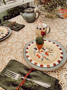 Vintage bird dishes and clay pot with mini moss ball for tablescape.