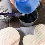 Add water to black paint. 