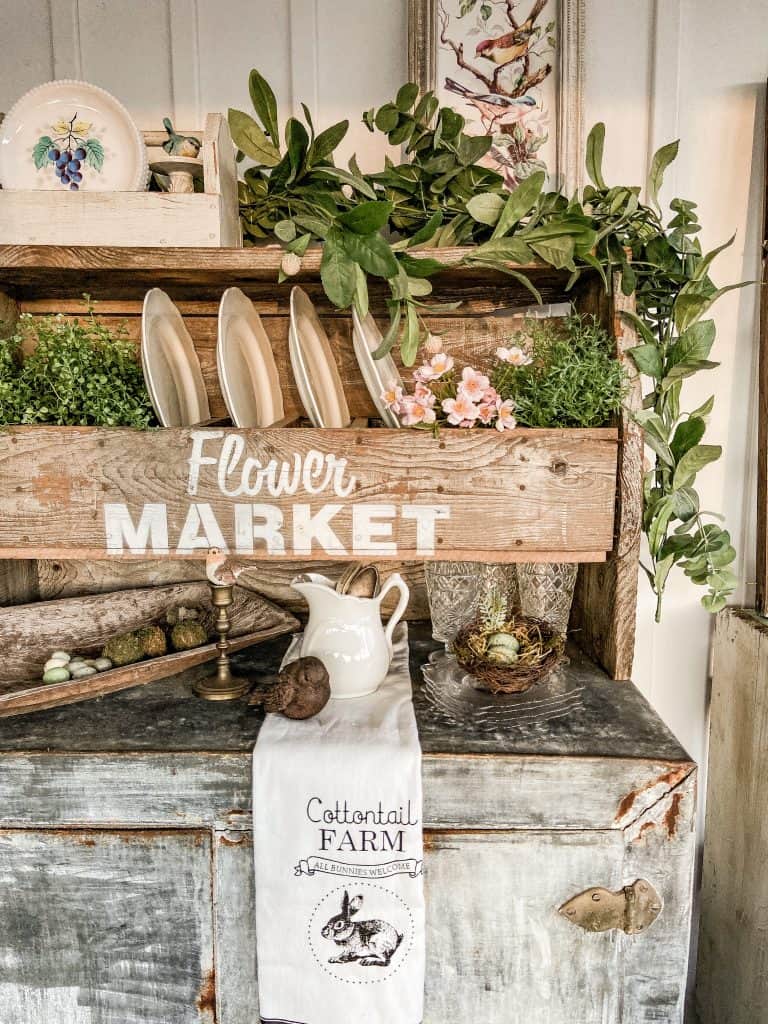 Vintage flower box repurposed into a plate rack.