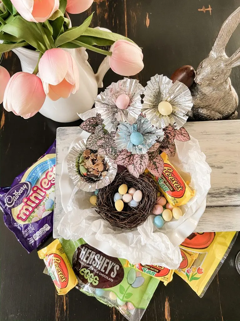 Easter candies in bird nest. Easter table display.