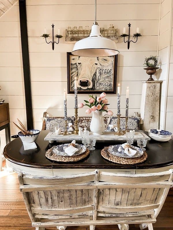 Spring Dinner Party tablescape with blue and white dishes and candles.  Pink tulips.  