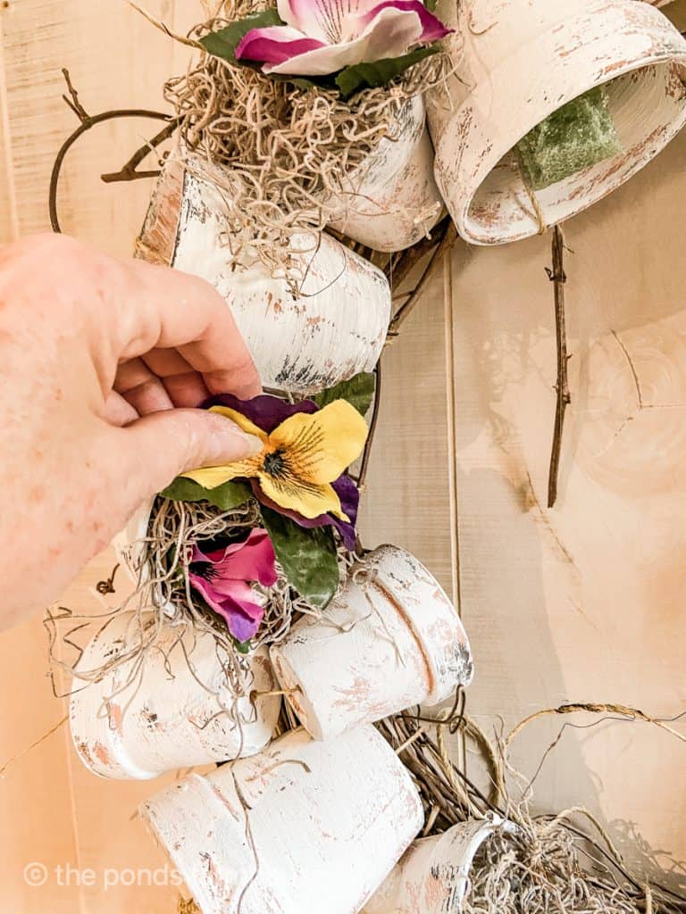 Hot Glue Pansies in terra cotta pots to make spring wreath.  Spring Wreath Door