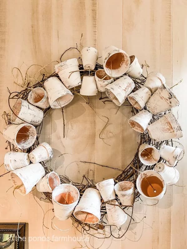 tie dollar tree pots to the grapevine wreath 