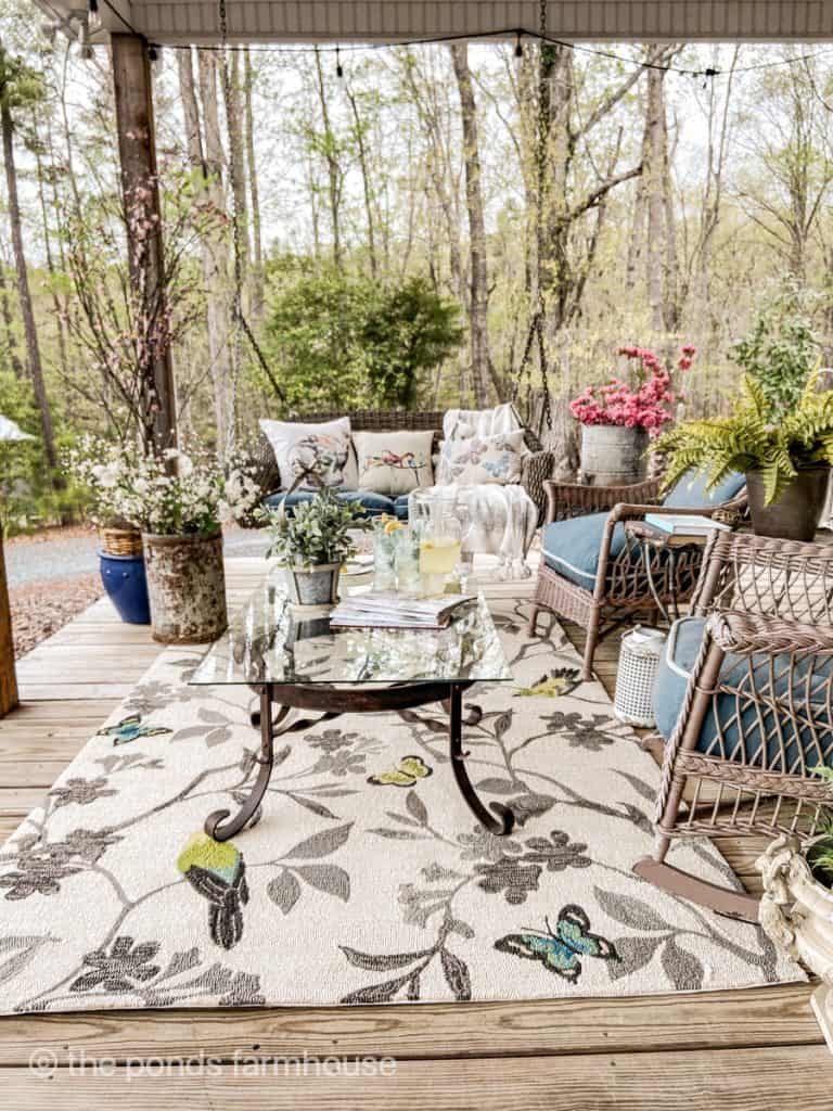 Create a outdoor seating area with porch rug