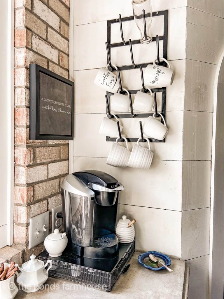 Forage Iron Bottle drying rack filled with coffee mugs and Keurig coffee machine.