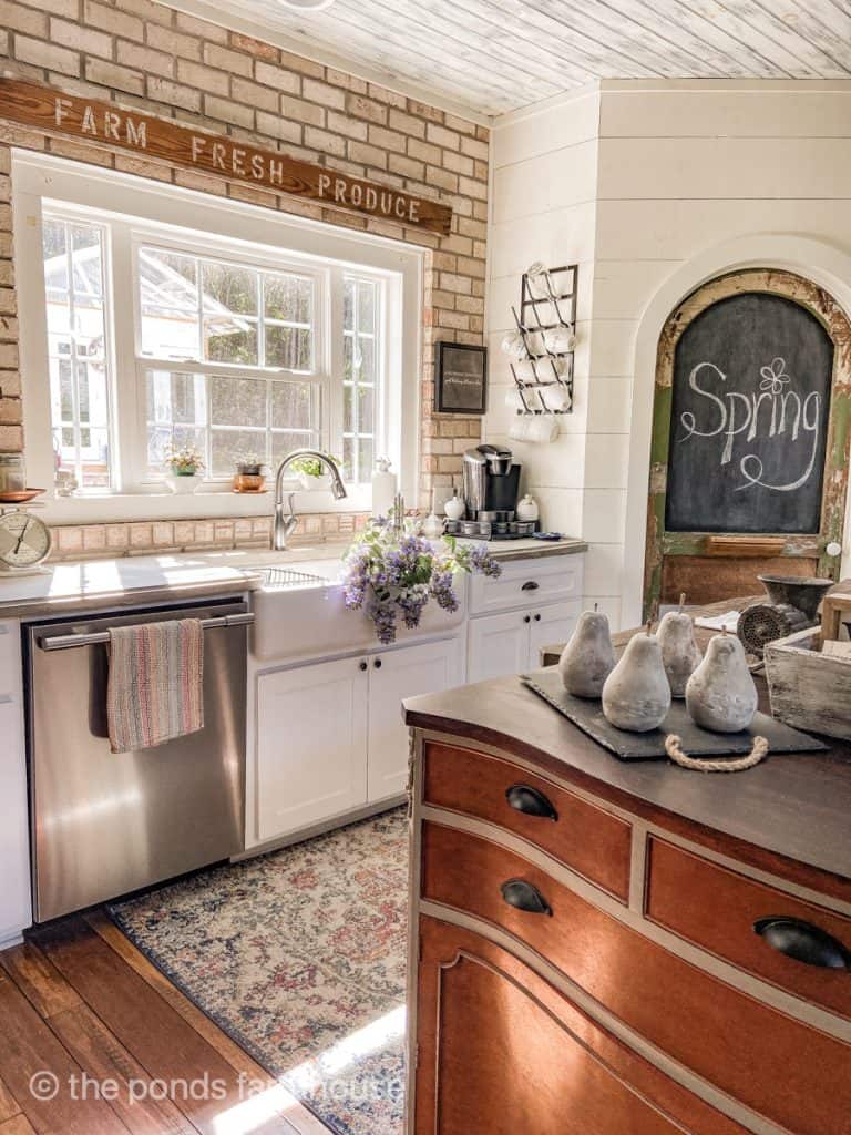 Brick backsplash, shiplap walls, apron front sink and pantry door for Modern Farmhouse Style Decorating.