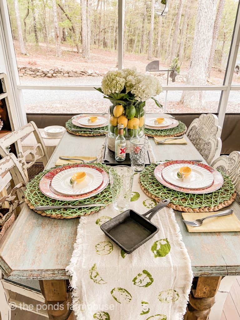 Cinco de mayo Tablescape with festive placemats and chargers. Decorating with Dos Equis salt and pepper shakers.