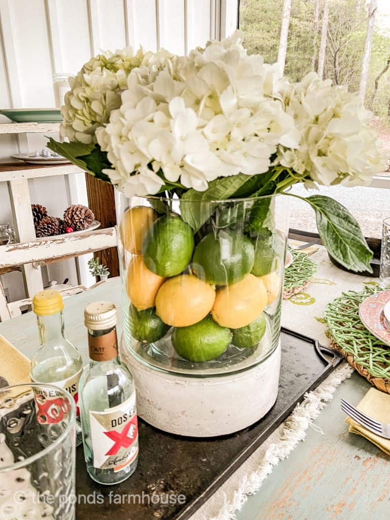 Lemons and Limes with Hydrangea flowers for a fruit and flower centerpiece idea. 