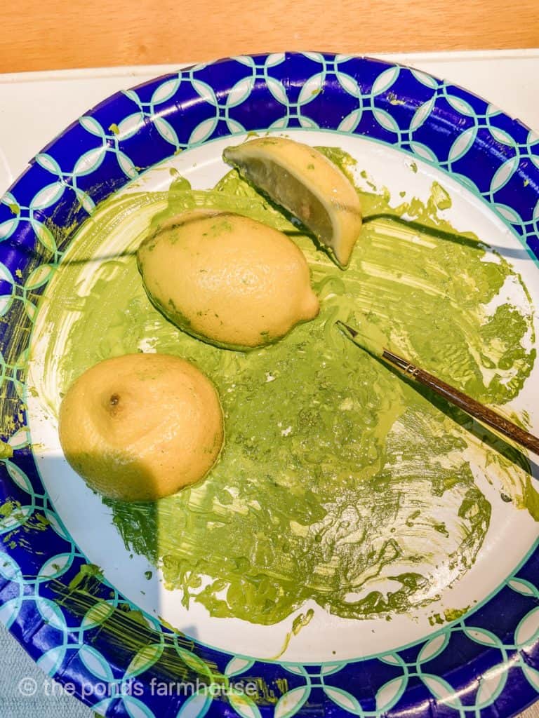 add lemons and limes in green paint to stamp the DIY Table Runners made of  Drop Cloth