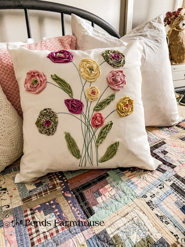 DIY Scrap Fabric Flower Pillow Cover on bed