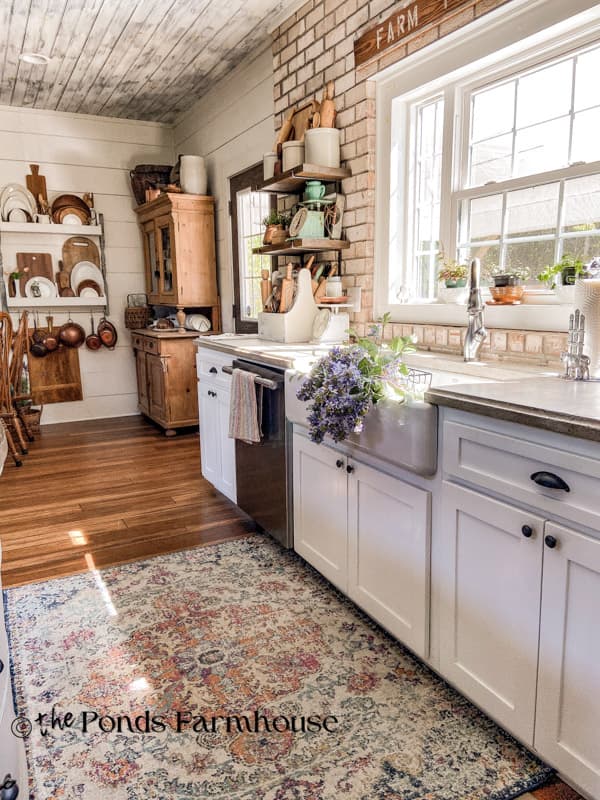 kitchen cabinets with farmhouse sink and old hutch