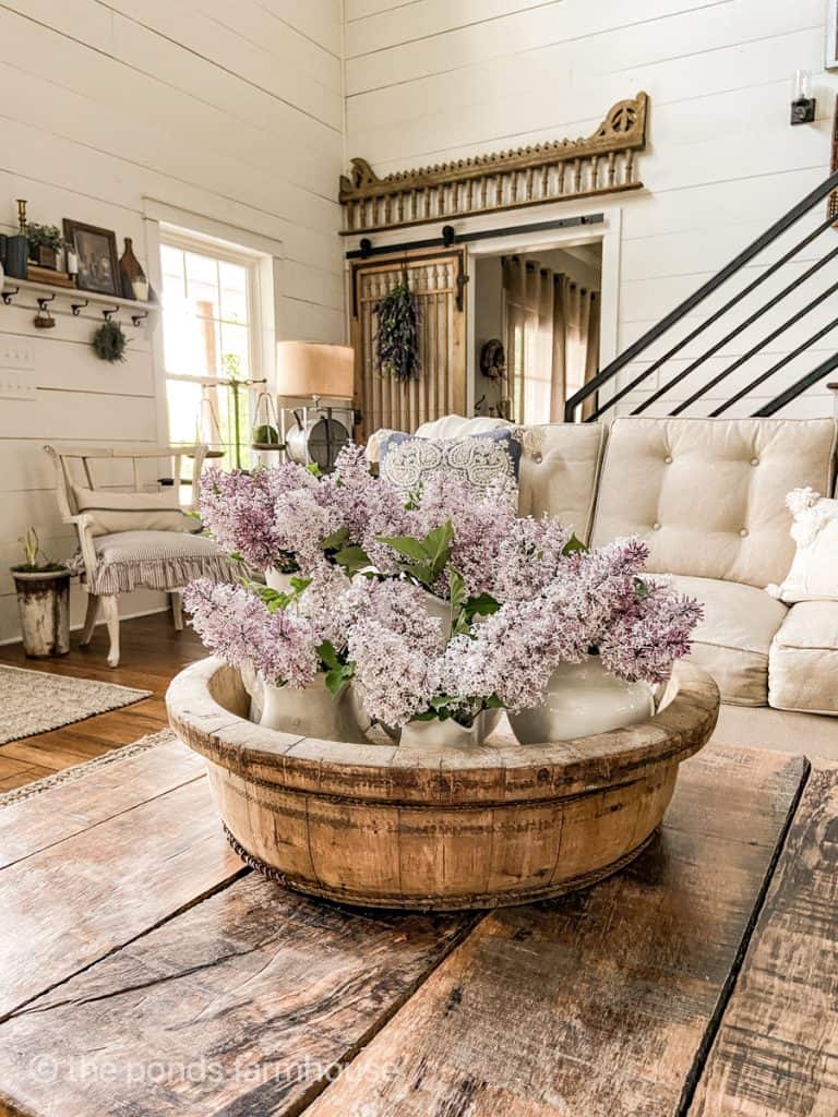 Fresh Lilacs in wooden bowl for coffee table decorations