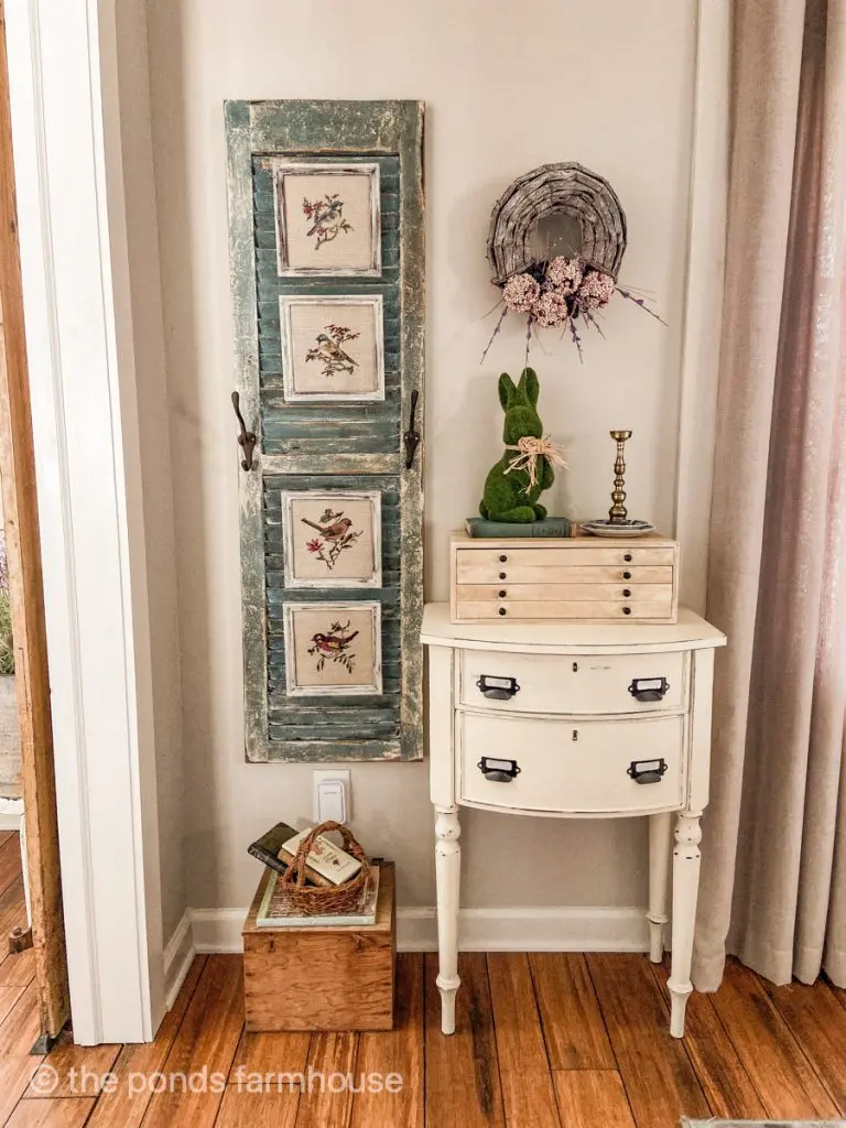 Decorate with vintage thrift store finds, needle point bird prints and chalk painted side table.  