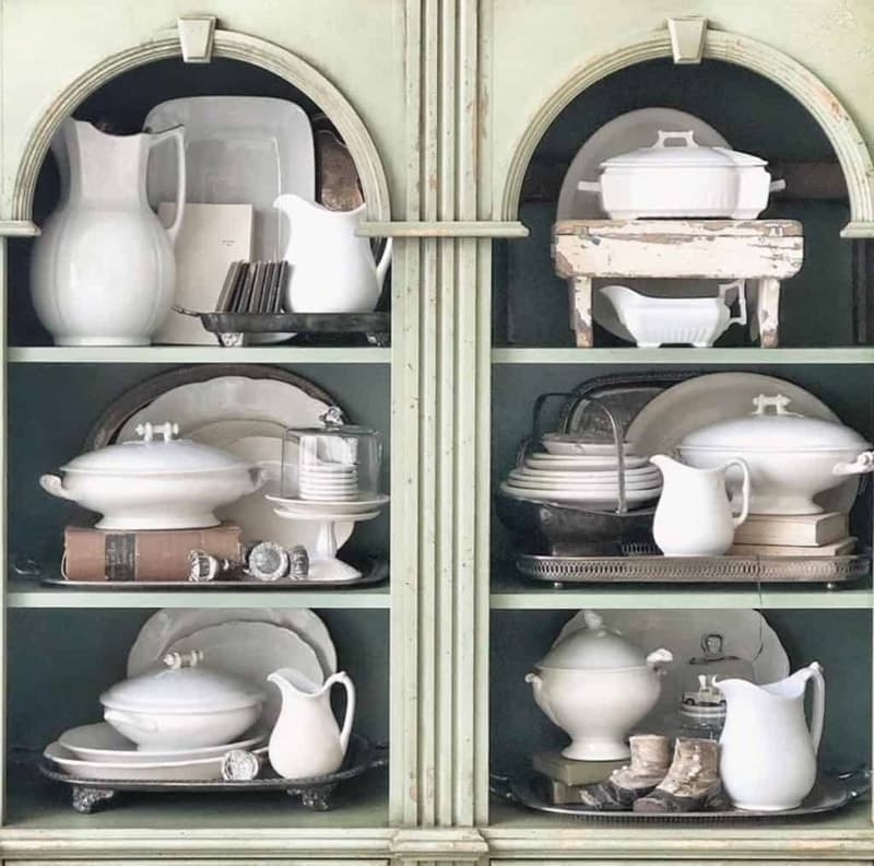 Vintage ironstone displayed in hutch