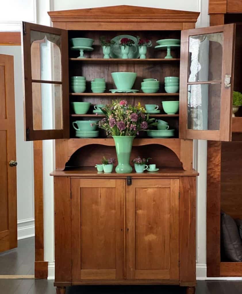 Antique hutch filled with antique jadiete & vintage treasures for classic farmhouse style decorating.