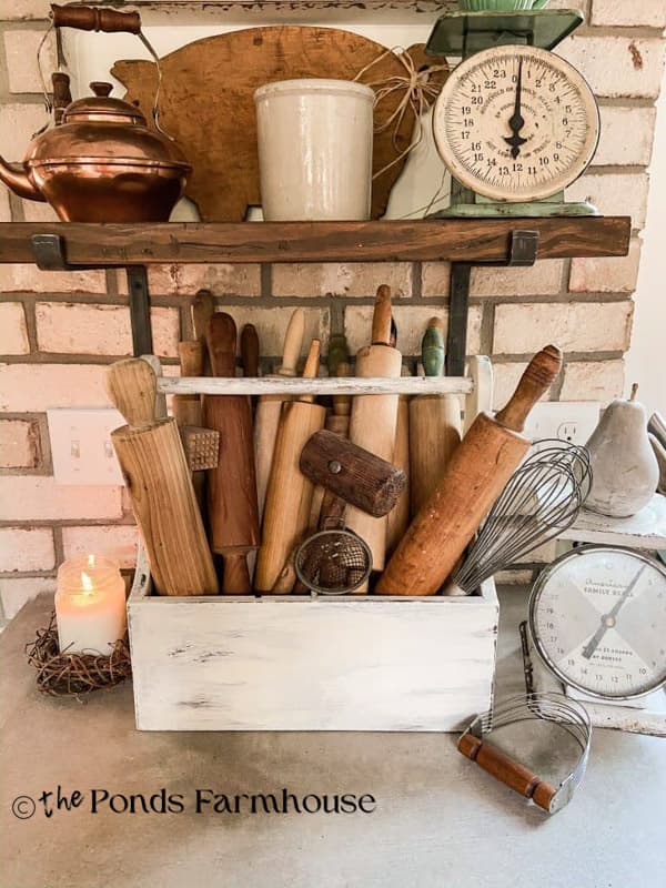 vintage tool box with rolling pins and open shelf