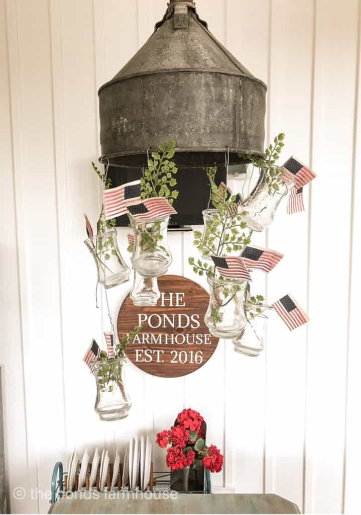 Light fixture filled with mini flags for 4th of July Porch Decorations. 