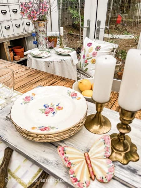 vintage dishes & brass candlestick holders for garden party table