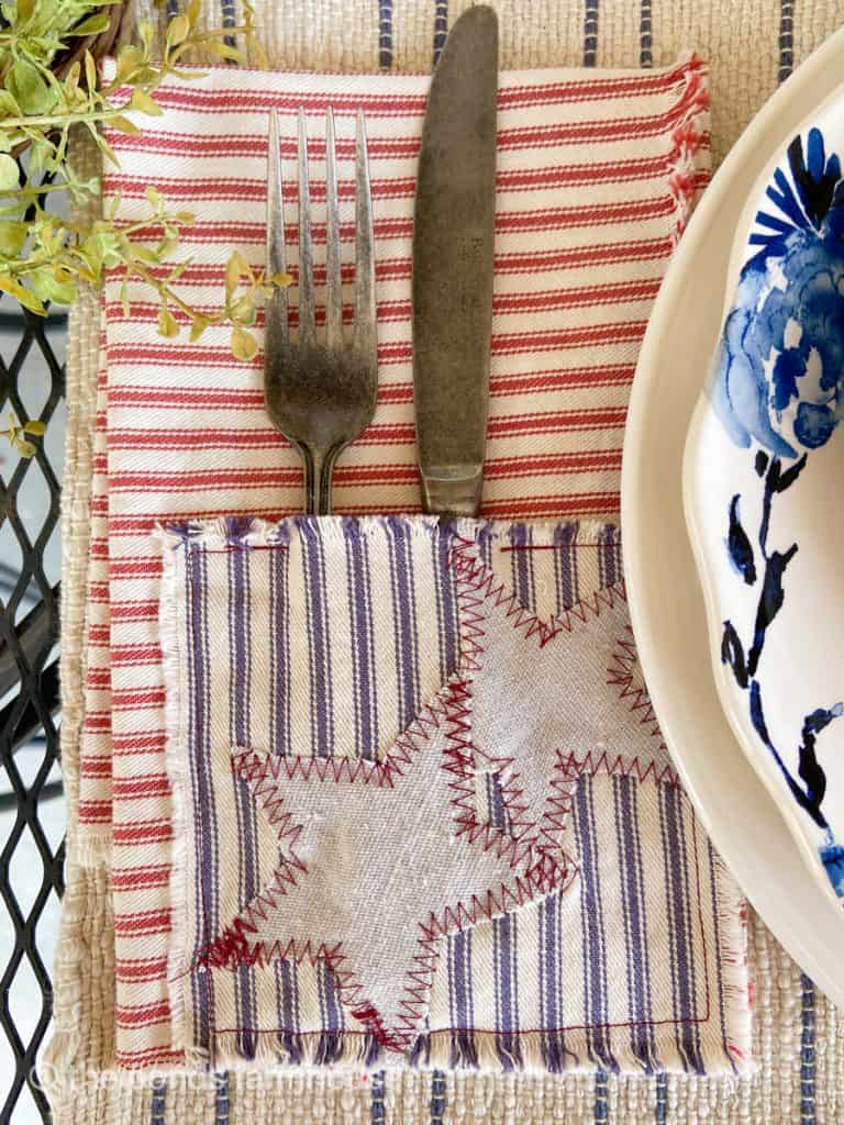 DIY Scrap Fabric Craft: Ticking Fabric Napkins with cutlery pockets for Patriotic Tablescapes.