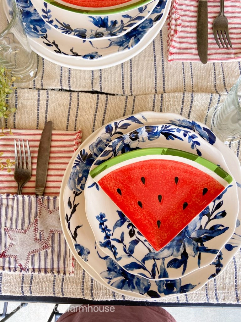 Patriotic Decorating for a fourth of July dinner party with watermelon dishes and DIY nakpins.