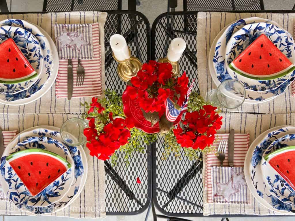 Easy Fourth of July Outdoor Table Setting with blue and white dishes, watermelon slice plates and DIY patriotic napkins.