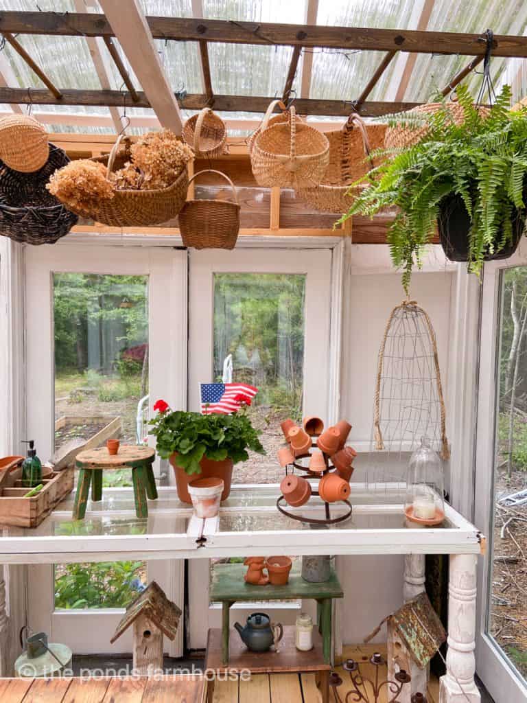 DIY Potting table in She Shed / Greenhouse with plants and clay pots for a Rustic farmhouse Decor Style
