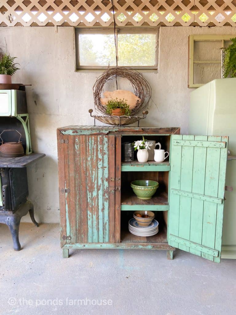 Antique Furniture - Chippy Primitive Cabinets with chippy green paint in outdoor kitchen. 
