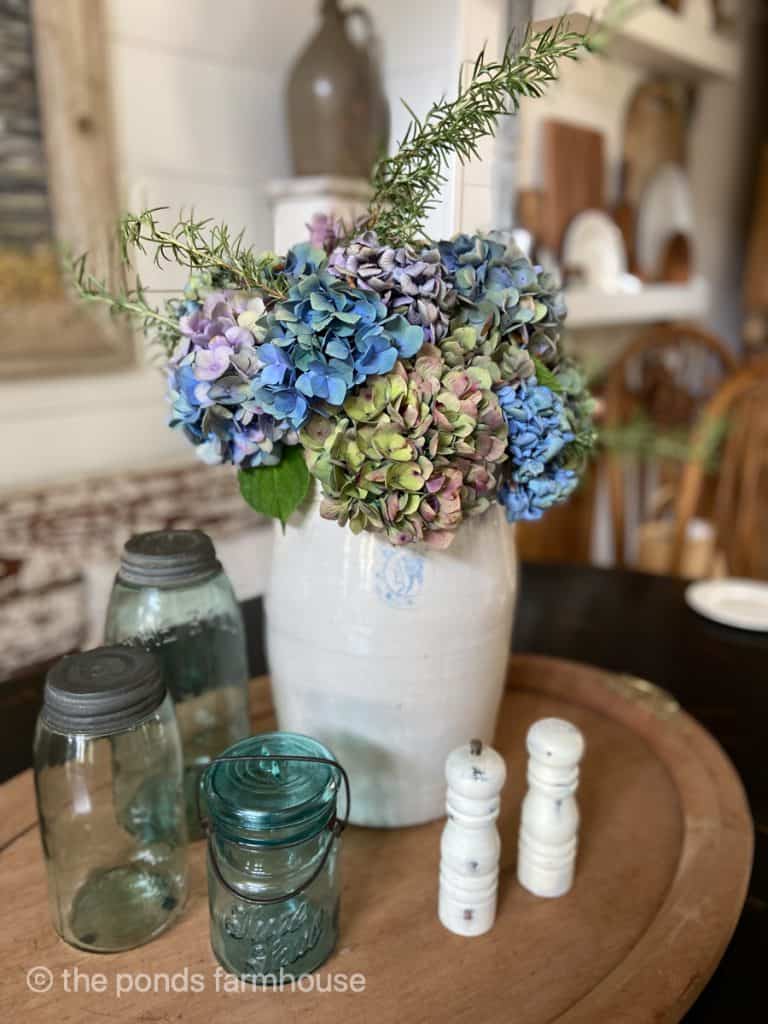 Fresh Hydrangeas make a beautiful table centerpiece when placed in large stoneware crock.
