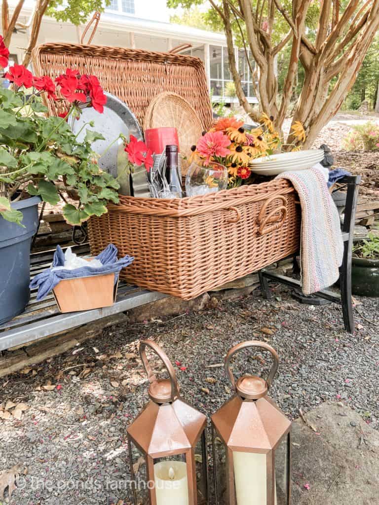 Summer Picnic with a picnic basket filled with black eyed susans and picnic supplies.  