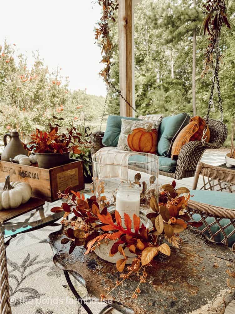Fall Ideas for Front Porch Decorating with blues and rust colors on front porch swing.  