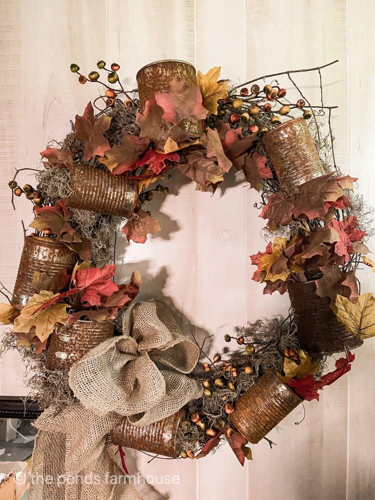 DIY Fall Wreath using rusty tin cans and dollar store florals.  