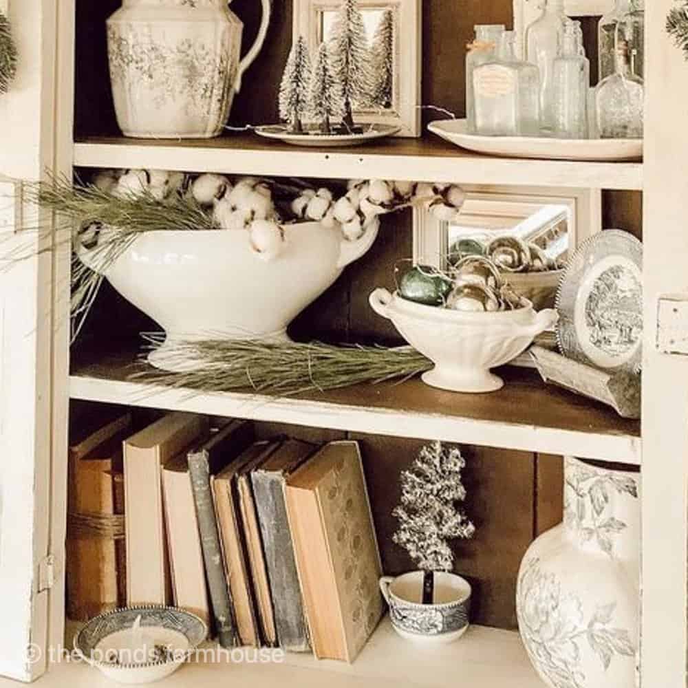 Vintage step back hutch with budget friendly vintage treasures found at Thrift Stores.  