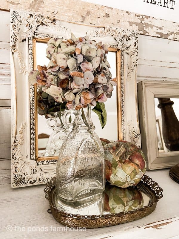 Vintage Mirrors, dried hydrangeas, vintage tray combine for fall repurposed fireplace mantel decor