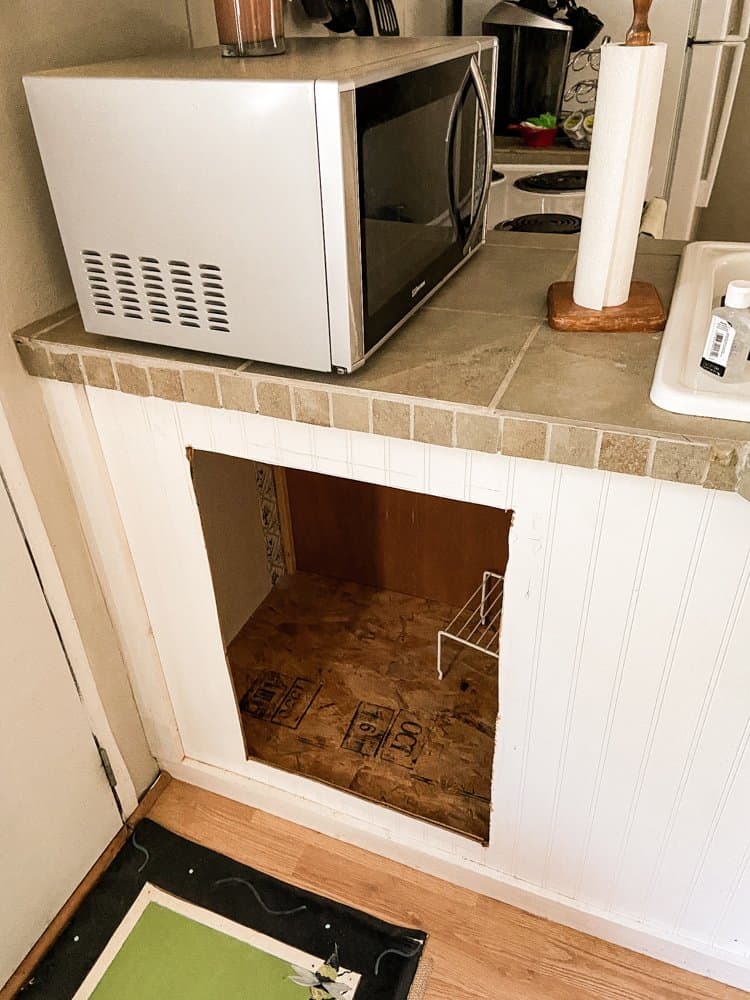 cut hold for new door in kitchen cabinets