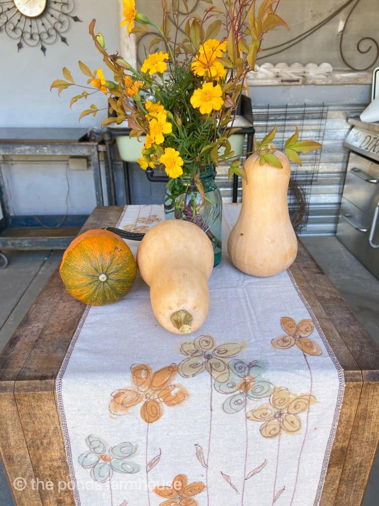 Gourds and garden flowers in outdoor kitchen