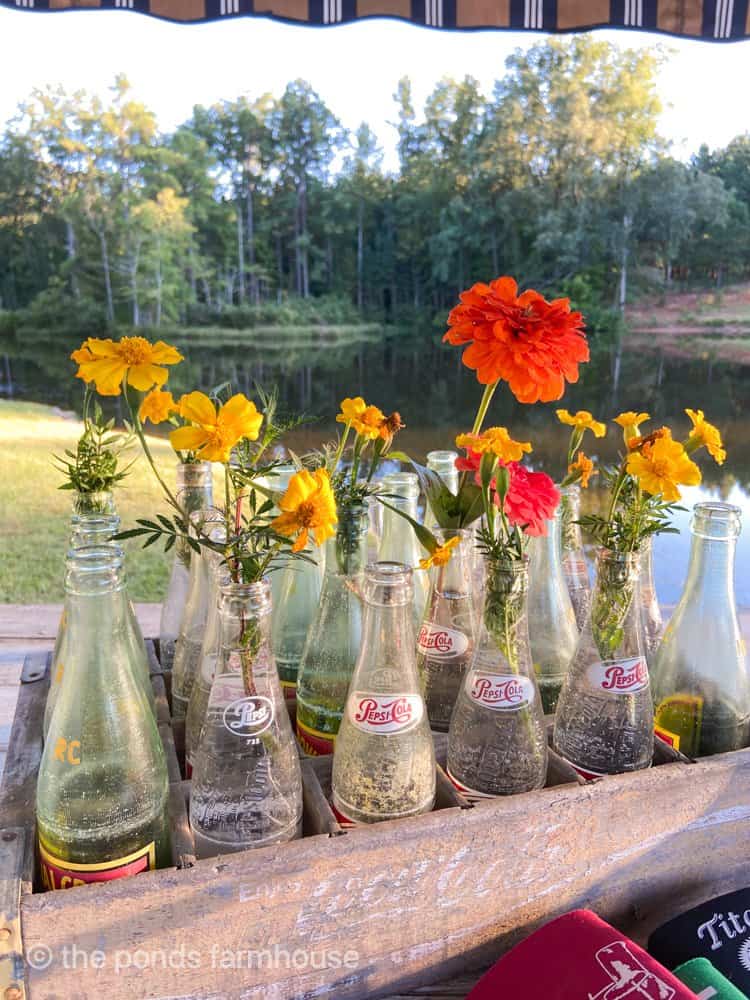 Vintage Pepsi Bottles used for a flower centerpiece inside a wood coke crate.