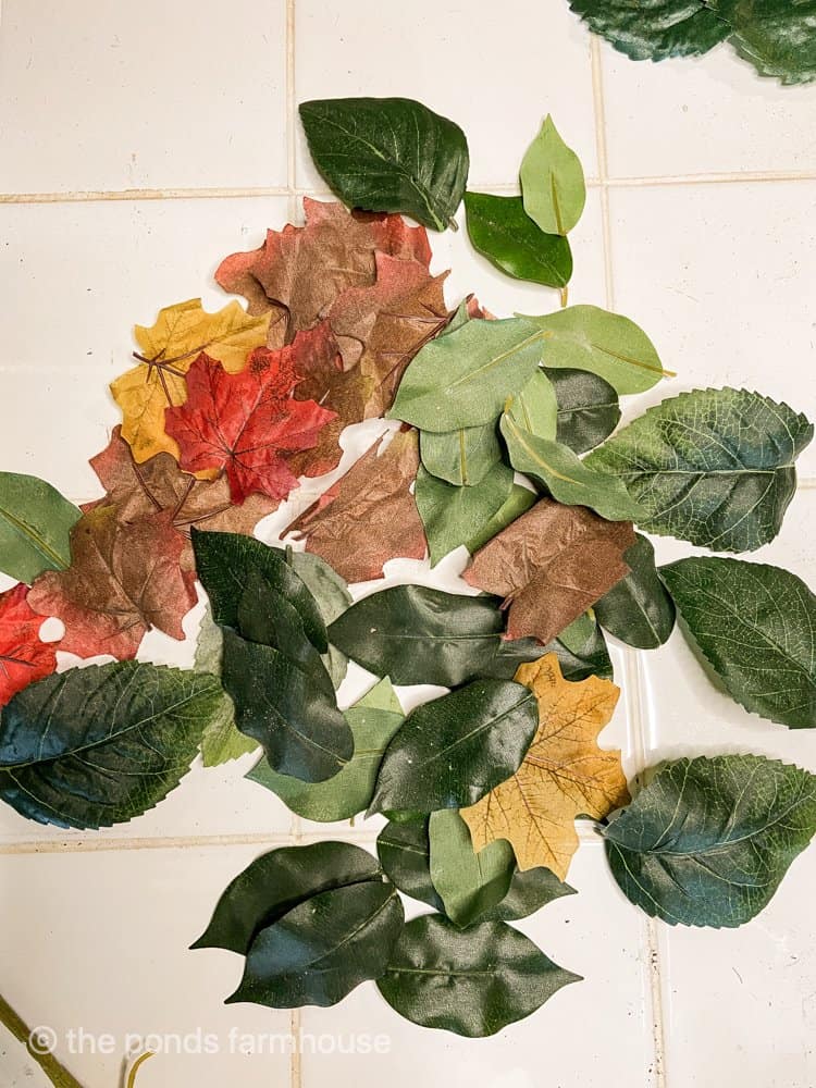 Recycle old faux leaves for fall projects. 