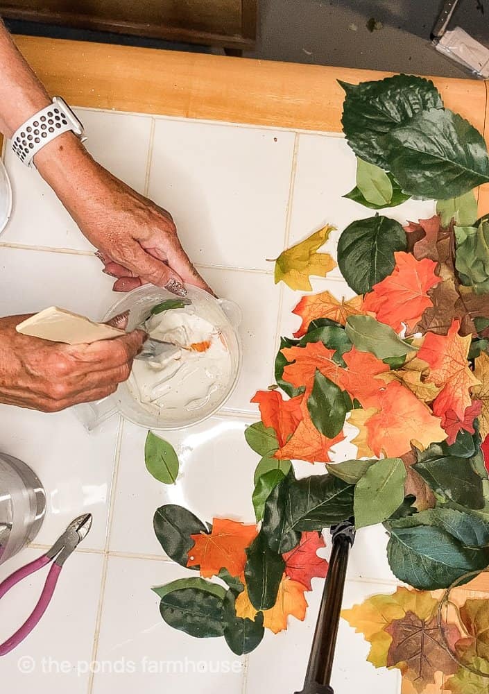 Mix plaster of paris for Fall craft project with recycled leaves.