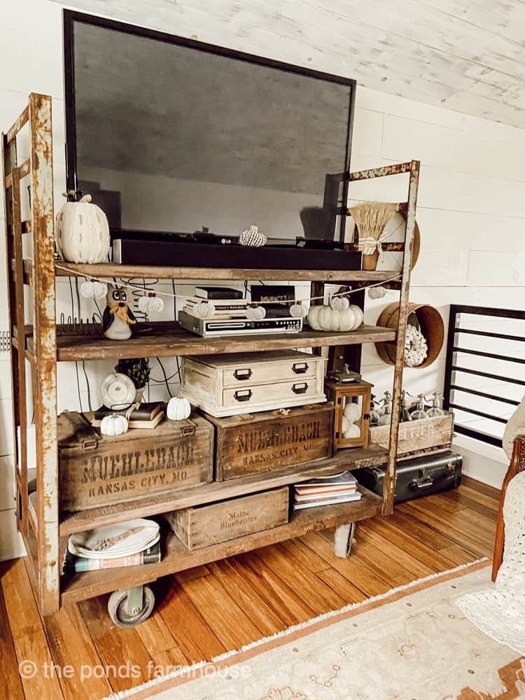 Upcycled Thrift Store Decor - Industrial commercial cart repurposed into a TV cart. 